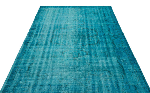 Load image 1 in gallery view. Teal distressed area rug with a faded traditional medallion pattern on a white background.
