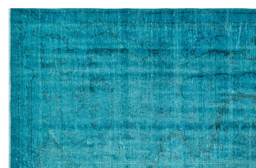 Load image 1 in gallery view. Teal overdyed rug with a faded, distressed traditional floral pattern and a dark border.