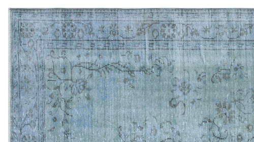 Load image 1 in gallery view. Light blue and grey distressed rug with a faded traditional floral medallion pattern.