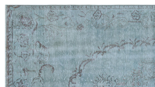 Load image 1 in gallery view. Light blue distressed rug with a faded brown floral pattern and a traditional border.