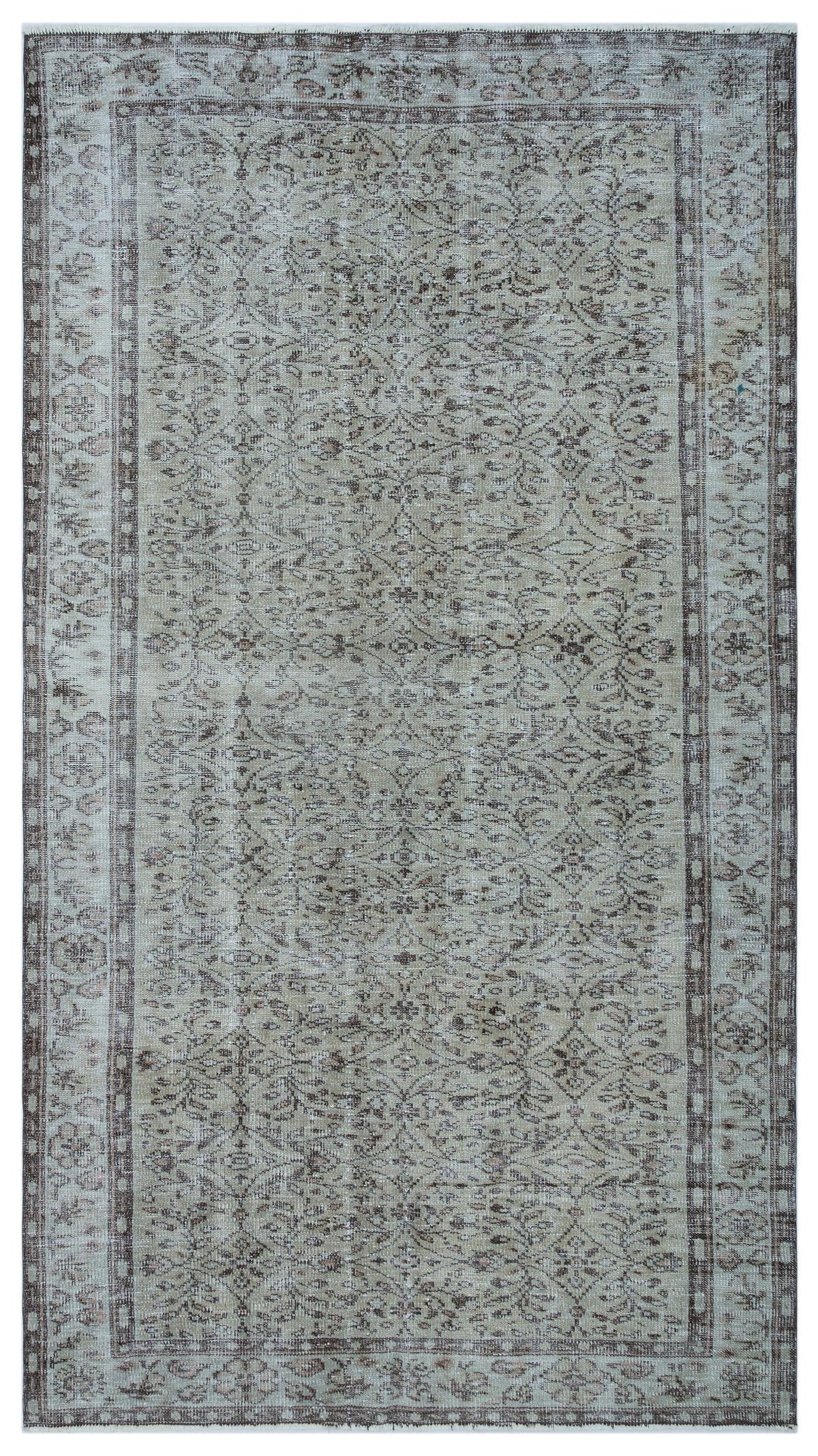 Beige and brown vintage-style rug with a distressed floral medallion pattern and a decorative border.
