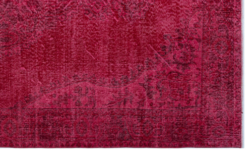 Load image 1 in gallery view. Magenta distressed rug with a faded traditional floral medallion pattern and a dark border.