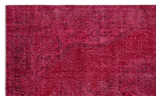 Load image 1 in gallery view. Deep magenta vintage-style rug with a distressed, faded traditional floral medallion pattern.