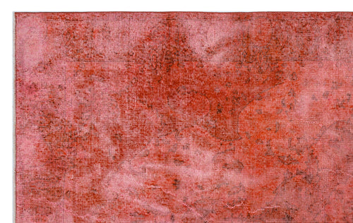 Load image 1 in gallery view. Distressed red and pink overdyed rug with a faded, textured vintage pattern.