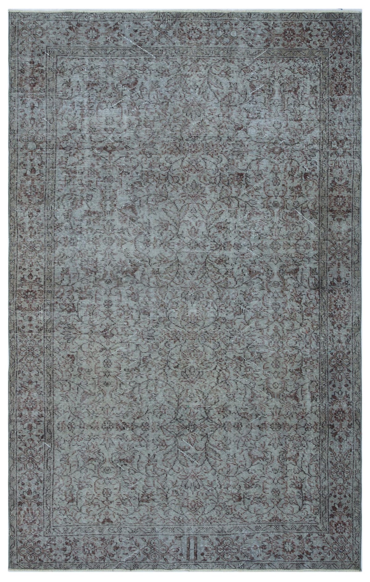 Distressed grey and brown traditional rug with a faded floral medallion pattern and a detailed border.
