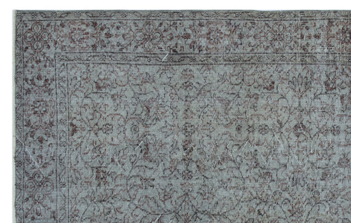 Load image 1 in gallery view. Grey and brown traditional rug with a distressed floral vine pattern and a decorative border.