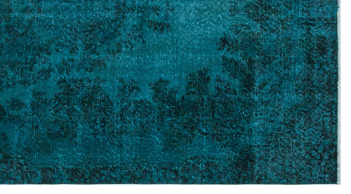 Load image 1 in gallery view. Teal and black rug with a distressed, faded traditional floral medallion pattern.