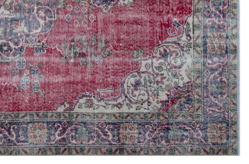 Load image 1 in gallery view. Distressed red, navy, and cream rug with a traditional floral medallion pattern and an ornate border.