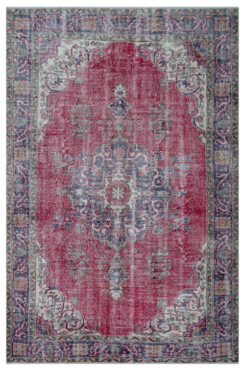 Load image 1 in gallery view. Distressed red, blue, and cream traditional rug with a central floral medallion and ornate border.