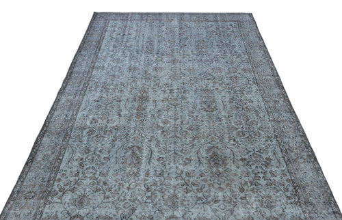 Load image 1 in gallery view. Blue and charcoal grey vintage-style rug with a distressed floral medallion pattern on a white background.