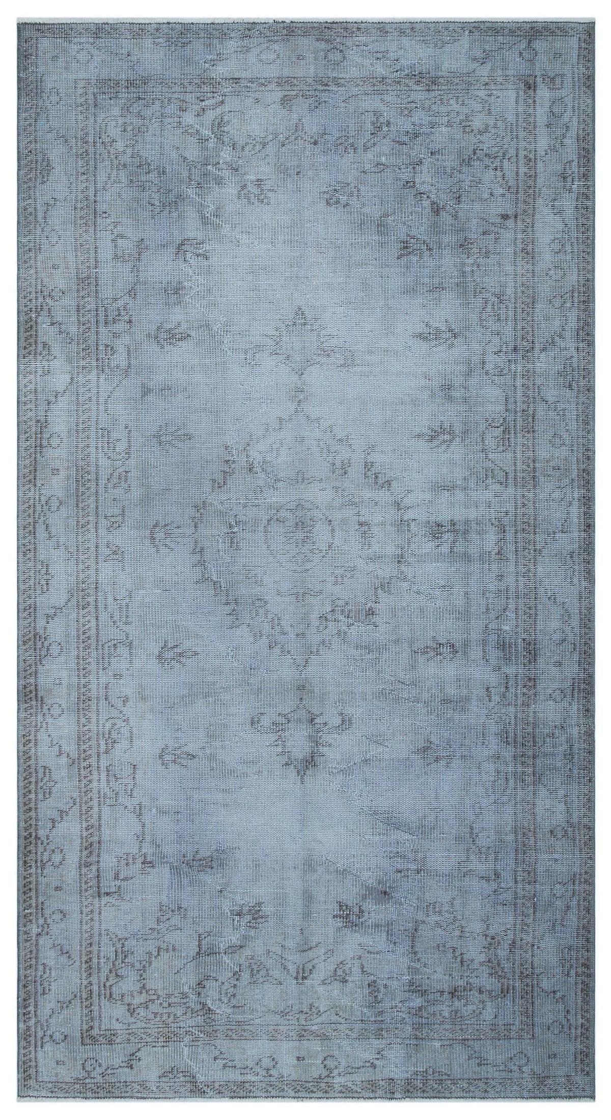 Light blue and grey distressed traditional rug with a central medallion and ornate border pattern.