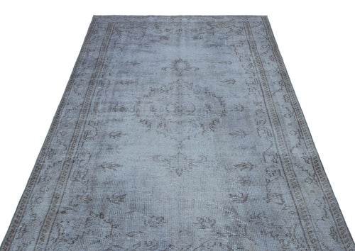 Load image 1 in gallery view. Light gray and taupe distressed vintage-style rug with a central medallion and ornate border pattern.