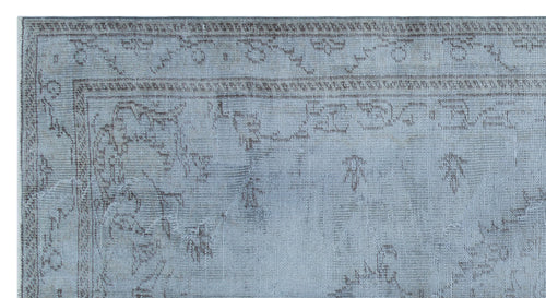Load image 1 in gallery view. Light blue and grey distressed rug with a faded traditional floral border and central medallion pattern.