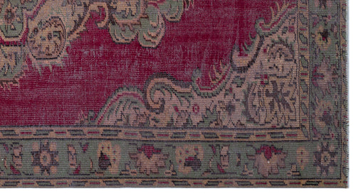 Load image 1 in gallery view. Distressed crimson rug with sage green and beige ornate floral borders and a traditional medallion pattern.