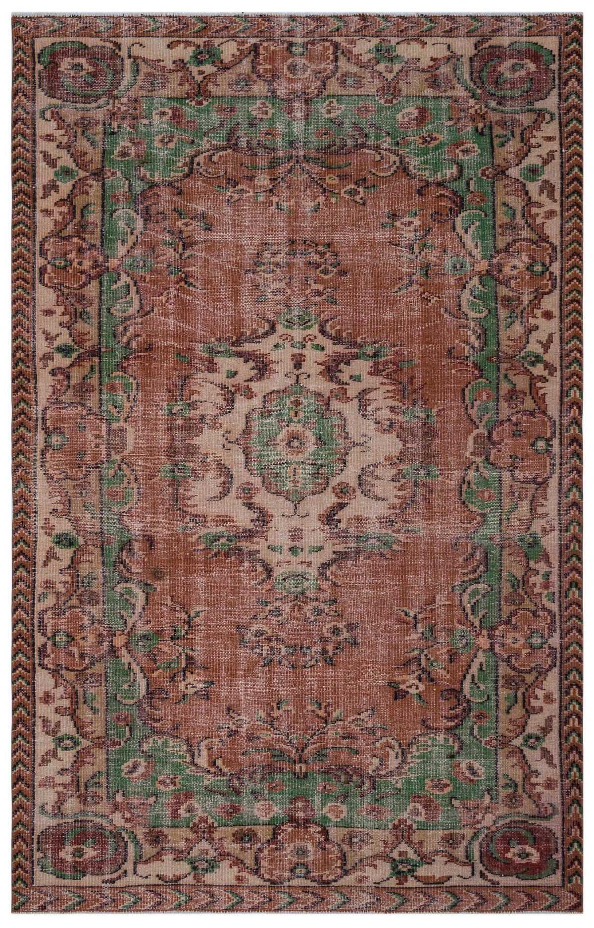 Terracotta, green, and cream traditional rug with a distressed floral medallion pattern and a geometric border.