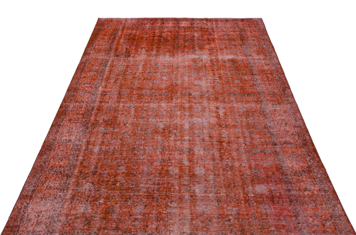 Distressed terracotta red vintage-style rug with a faded, overdyed texture on a white background.