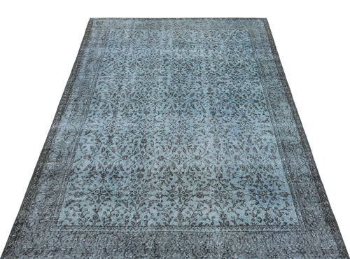 Load image 1 in gallery view. Distressed blue and charcoal grey rug with an intricate floral medallion pattern and a wide decorative border.