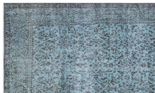 Load image 1 in gallery view. Distressed blue and charcoal grey rug with a traditional floral medallion pattern and a detailed border.