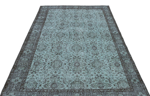 Load image 1 in gallery view. Teal and charcoal distressed rug with a traditional floral medallion pattern and a wide decorative border.