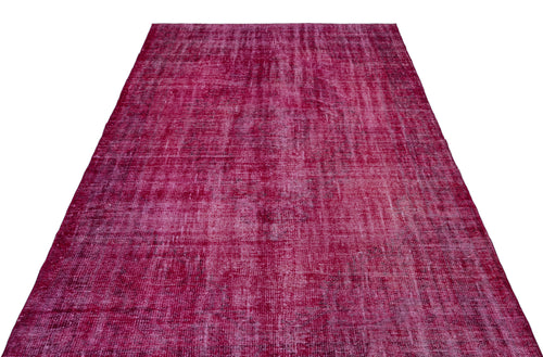 Load image 1 in gallery view. Magenta distressed vintage-style rug with a faded, textured overdyed pattern on a white background.