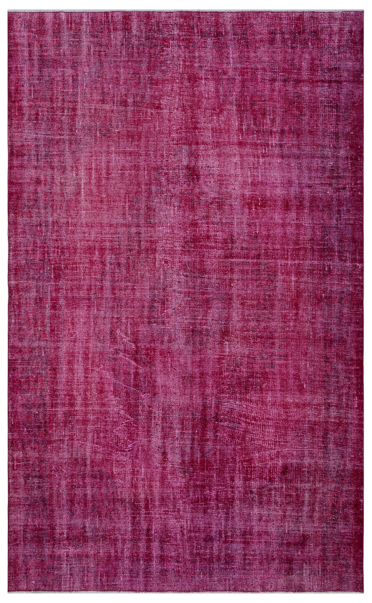 Magenta overdyed vintage-style rug with a distressed, textured finish.