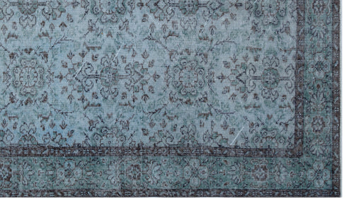 Load image 1 in gallery view. Distressed light blue and charcoal grey rug with a traditional floral medallion pattern and a detailed border.