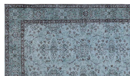 Load image 1 in gallery view. Teal and charcoal distressed rug with a traditional floral medallion pattern and a decorative border.