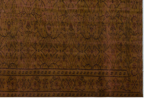 Load image 1 in gallery view. Brown rug with a dark brown diamond lattice pattern and a geometric border.