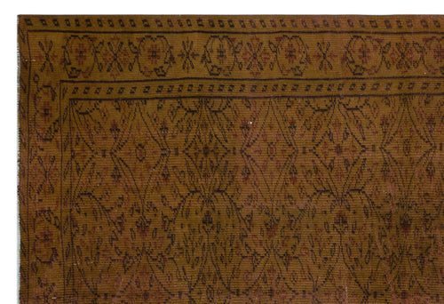 Load image 1 in gallery view. Mustard yellow and brown traditional rug with a geometric diamond lattice pattern and a decorative floral border.