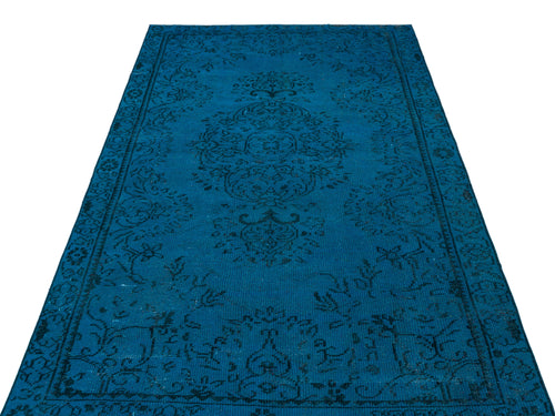 Load image 1 in gallery view. Deep blue rug with a black traditional floral medallion pattern on a white background.