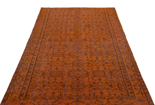 Load image 1 in gallery view. Burnt orange rug with a dark brown traditional geometric medallion pattern and a detailed border.