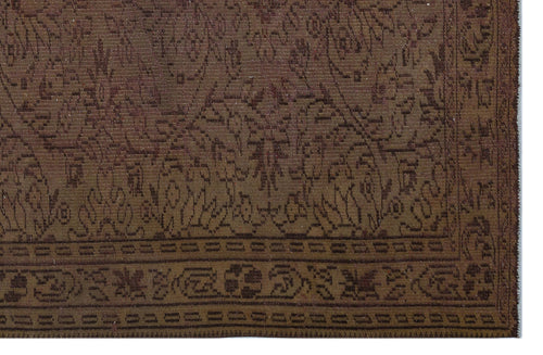 Load image 1 in gallery view. Dark brown traditional rug with a tonal floral medallion pattern and a geometric border.