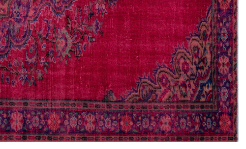Load image 1 in gallery view. Magenta vintage-style rug with a distressed floral medallion pattern and a dark ornate border.