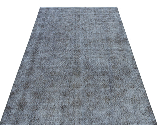 Load image 1 in gallery view. Grey and charcoal distressed area rug with a faded, vintage-inspired texture on a white background.