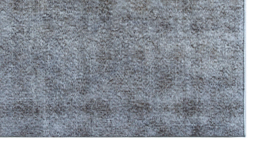 Load image 1 in gallery view. Charcoal and light gray distressed rug with a faded, textured abstract pattern.