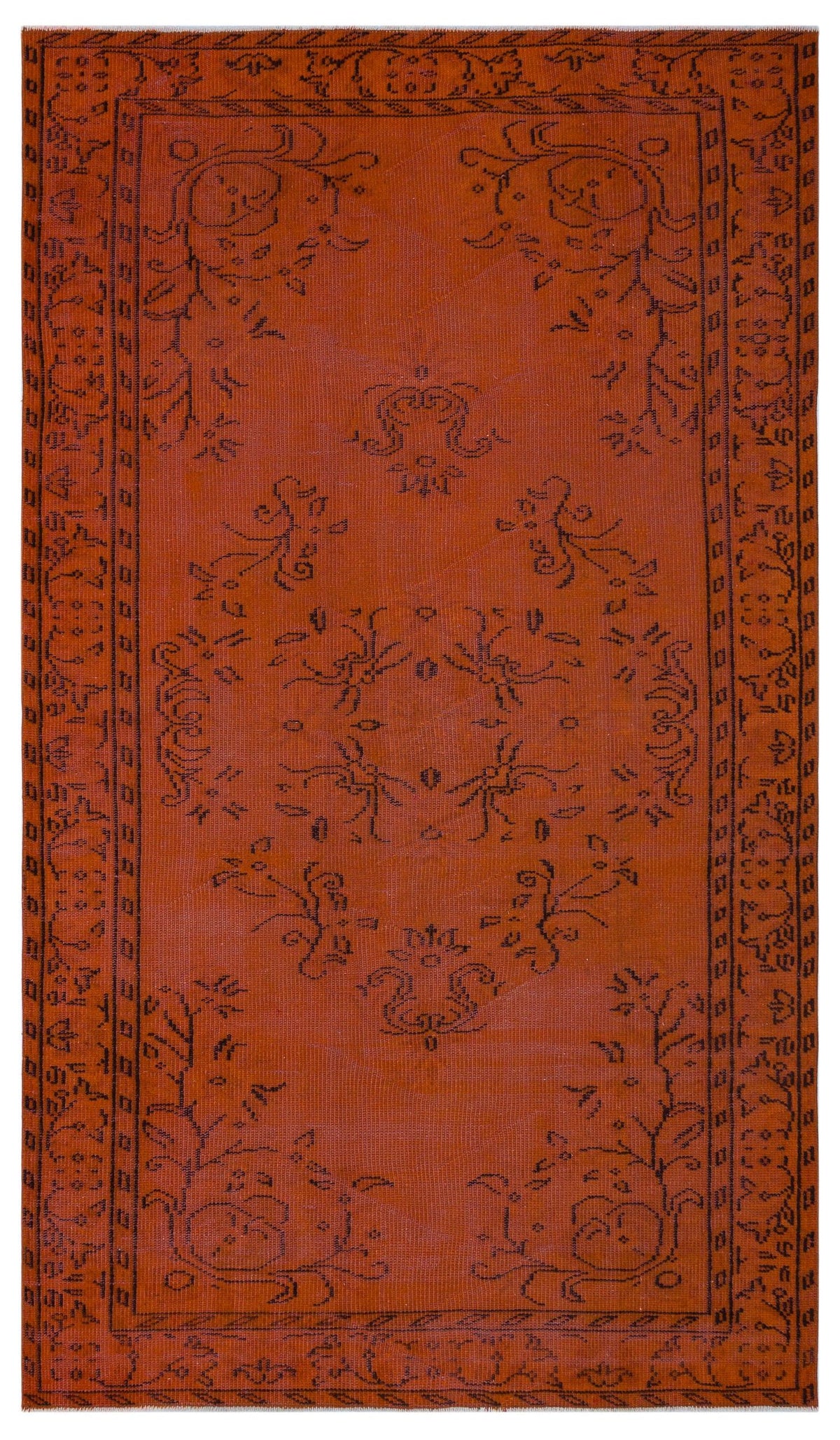 Rust-colored rug with a black linear floral medallion pattern and a decorative geometric border.