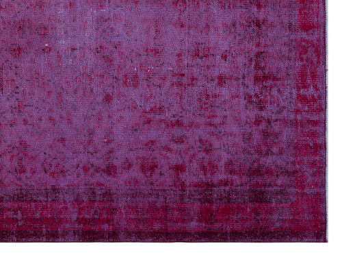 Load image 1 in gallery view. Magenta and purple distressed overdyed rug with a faded traditional pattern on a white background.