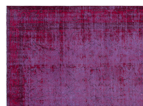 Load image 1 in gallery view. Magenta and purple distressed overdyed rug with a faded, textured pattern.