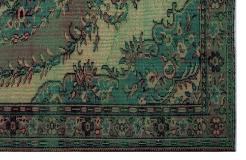 Load image 1 in gallery view. Distressed green and teal traditional rug with a faded floral medallion pattern and a detailed geometric border.
