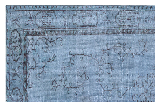 Load image 1 in gallery view. Distressed light blue rug with a dark grey floral vine pattern and a traditional geometric border.