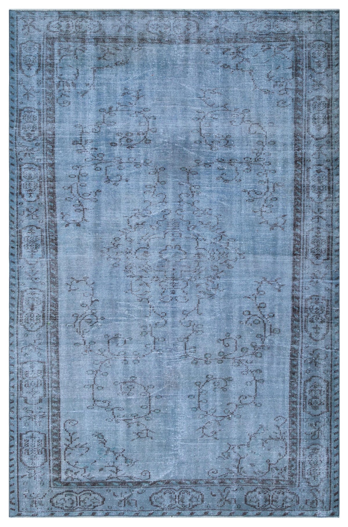 Distressed blue rug with a dark grey traditional floral medallion and border pattern on a white background.