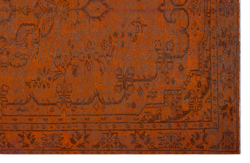 Load image 1 in gallery view. Rust-colored traditional rug with a dark brown distressed floral medallion pattern and a detailed border.