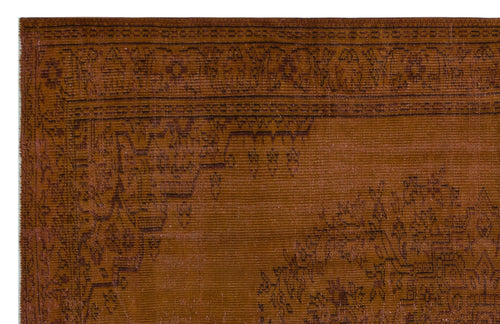 Load image 1 in gallery view. Rust-colored rug with a dark brown traditional border and ornate floral medallion pattern.