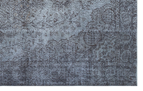 Load image 1 in gallery view. Grey and charcoal distressed rug with a traditional floral medallion pattern and a detailed border.
