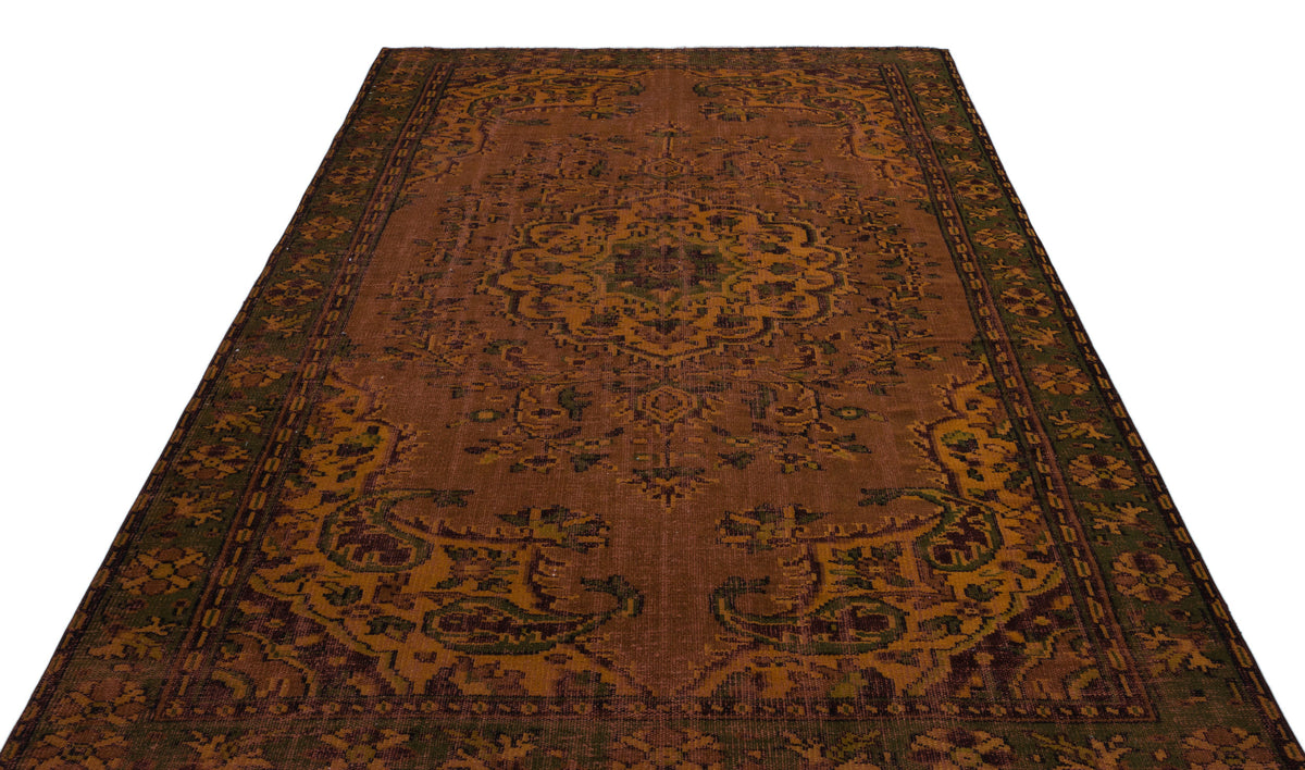 Rust and olive green traditional rug with a central medallion and ornate border pattern on a white background.