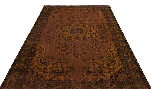 Load image 1 in gallery view. Rust and olive green traditional rug with a central medallion and ornate border pattern on a white background.