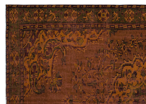 Load image 1 in gallery view. Rust and olive green traditional rug with a distressed floral medallion pattern and a geometric border.
