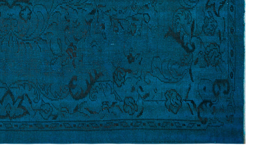 Load image 1 in gallery view. Teal rug with a black floral pattern and a geometric border.