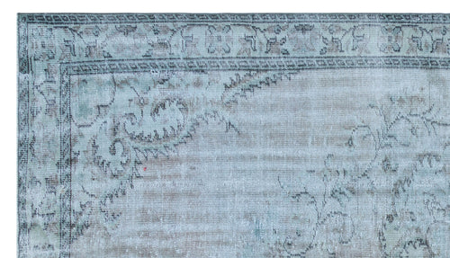 Load image 1 in gallery view. Distressed light blue and beige rug with a faded traditional floral border and central medallion pattern.
