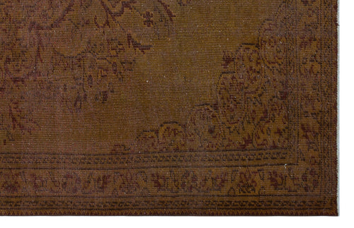 Load image 1 in gallery view. Brown traditional rug with a faded, distressed medallion pattern and a detailed border on a white background.